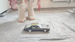 Giantess Jayne crushes toy car Oldsmobile in snakeskin heels ground view