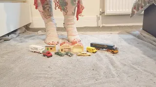 Giantess Jayne Vs tiny cars trucks buildings crushing them in snakeskin high heels ground view