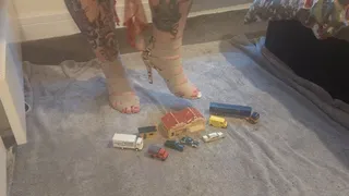 Giantess Jayne Vs tiny cars trucks buildings crushing them in snakeskin heels high view