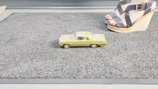 Abby Giantess toy car crush 1966 Pontiac GTO lower side view in sexy wedges with painted toes