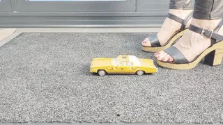 Abby Giantess toy car crush 1970 Cadillac Eldorado Rancer lower side view in chunky high heel sandals