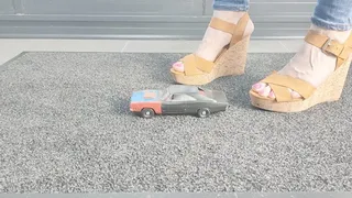 Ground view Abby Giantess crushes a 1968 Dodge Charger toy car in sexy wedges