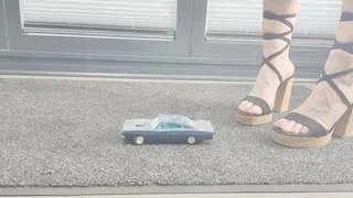 Abby Giantess toy car crush 1968 Dodge charger base in chunky Lacey heels low side view