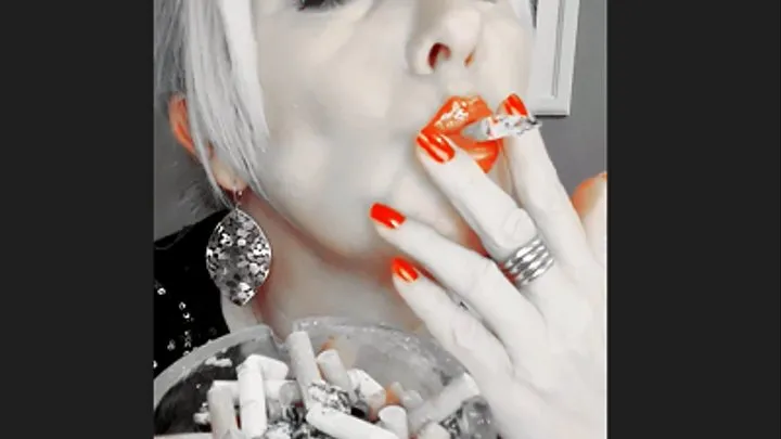 Smoker Mummy do chain smoke with deep powerful inhalations with lots of white smoke close up, in focus the red shiny lips and fingernails