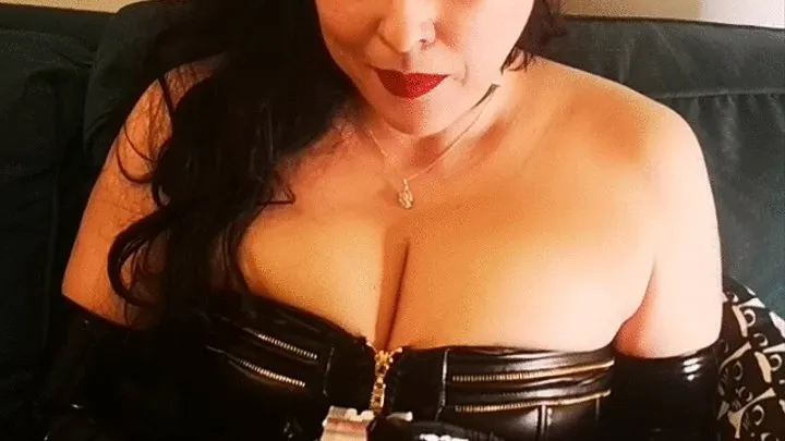 Mistress Cat JoJo smoking in leather corset and taking her big tits out