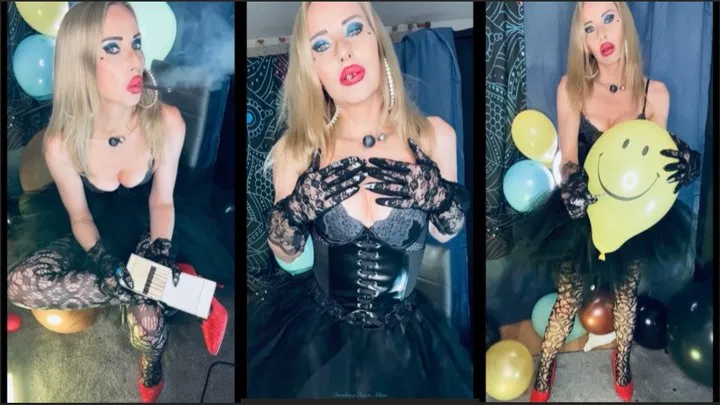 The sexy chain smoking witch is smoking a black sobranie while destroying some balloons