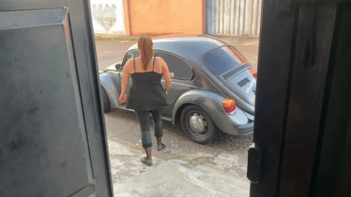 Barbara takes the VW Beetle out for a Sunday drive in flip flops and dark pantyhose