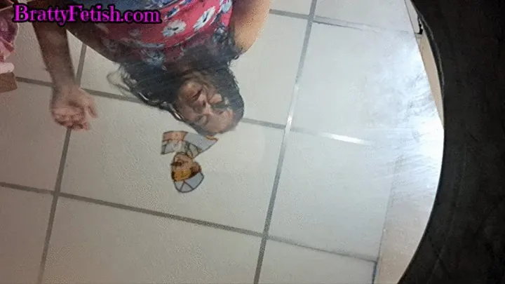 Paper man crushed under huge Latina feet and socks