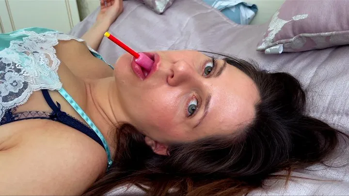 Exciting licking & sucking of lollipop with face close up