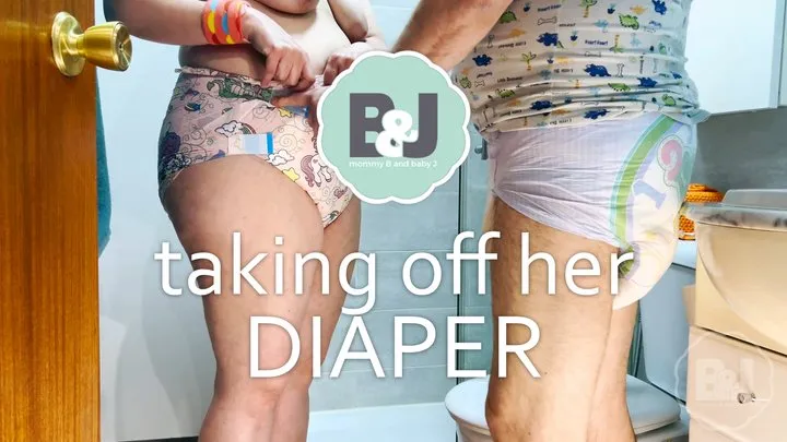 Taking off her diaper