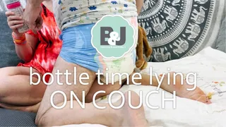 Bottle time lying on couch