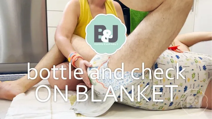 Bottle and check on blanket