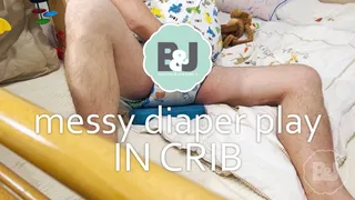 Messy diaper playing in crib