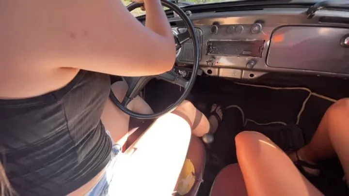 Jarlyn has fun driving barefoot on the highway with her co-pilot friend