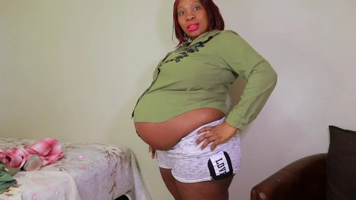 Ebony Pregnant Lady Trying on Tight Clothes