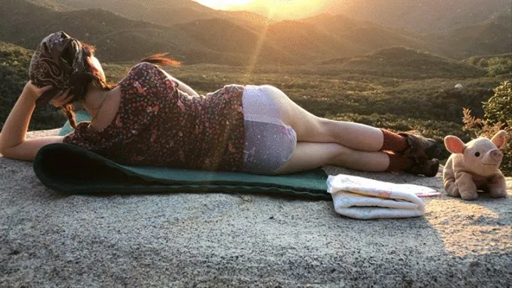 Diaper girl posing outdoors with sunset