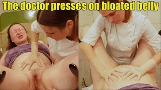 The doctor presses on the patient's bloated belly, and she screams and strains