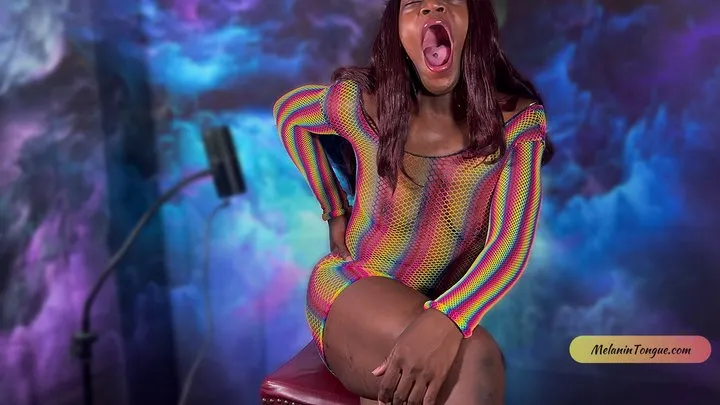 Yawns in sexy rainbow body suit from MelaninTongue