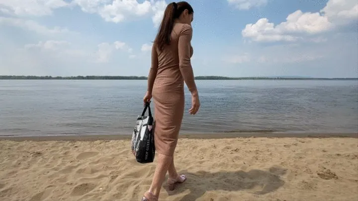 Vika gymnastics on the beach in a bikini and pigeons