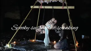 Spooky suspended spanking