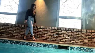 Reyna jumps in the Pool in Skinny Jeans and a Shiny Black Top