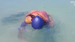 Swimcap and head dunking in the sea