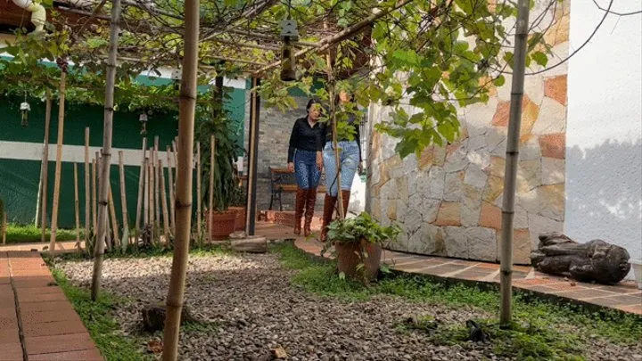 Kahina and Kalinda crush grapes with their brown boots