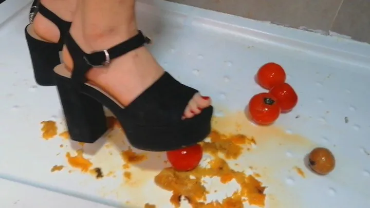 Sexy girl crushes fruits with high heels