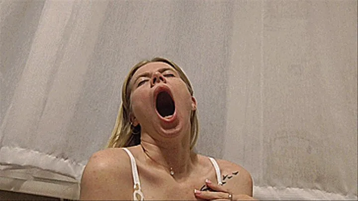 Sexy blonde yawns!