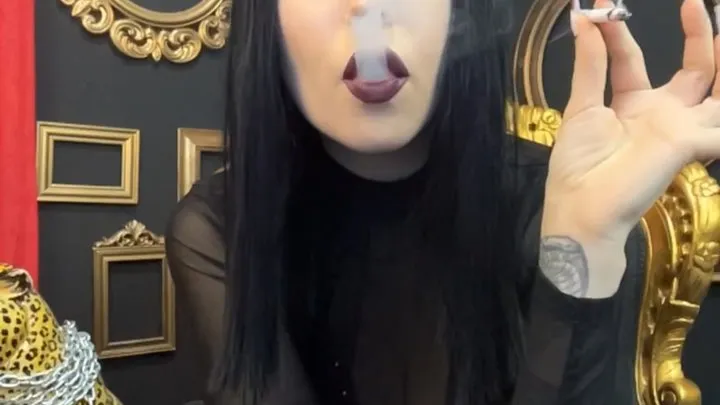 Smoking a cigarette in a teasing outfit