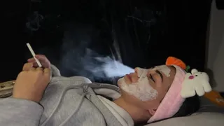 SMOKING HANDY NOSE EXHALES WHILE LYING IN BED