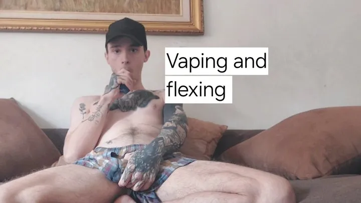 Skinny guy flexing and vaping