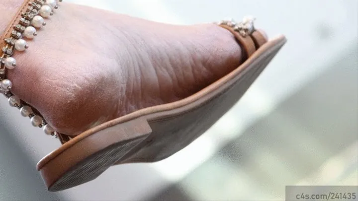 Beauty wrinkled feet dangling with sandals, candid foot fetish dangling