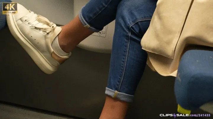 Brat and rude girl puts her dirty sneakers on train seat, drust shoeprint, sneakers shoe fetish