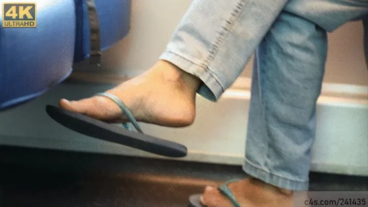 Flip flops dangling, cute feet close-up, foot fetish passion