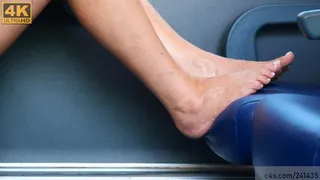 Candid Beauty barefeet on train seat