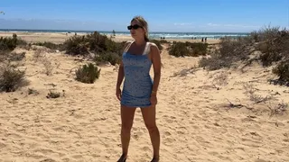 Spreading legs and peeing on the public beach