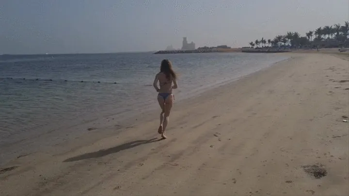 running and stretching on the beach