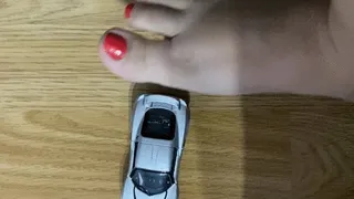 Giantess feet playing with car