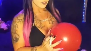 Smoking slut, popping balloon with a cigarette