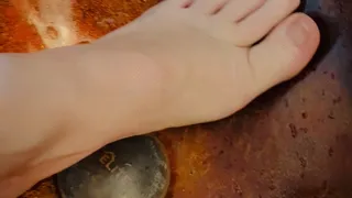 Nefariess washes her feet and clips and paints her toenails