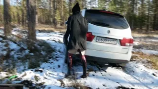 Hot chick in high heel boots gets stuck in the woods with a car and tries to get it out falls down and rolls around in the mud