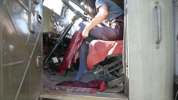 Girl in high heels red boots tames the monster truck from the USSR