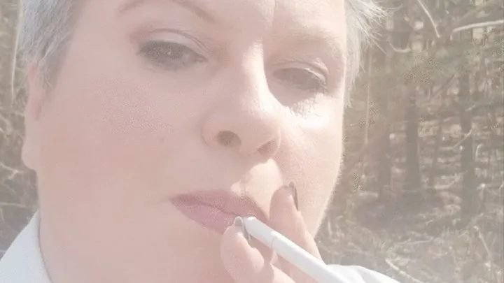 Mature Lady L outdoors smoking clip #1