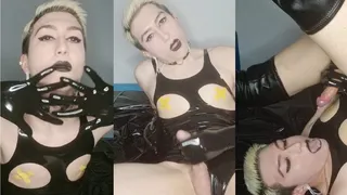 Kinky sissy in shiny latex bodysuit and high boots plays with cock and cums in her mouth