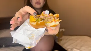 a pregnant woman is on a diet, but breaks down and orders to eat