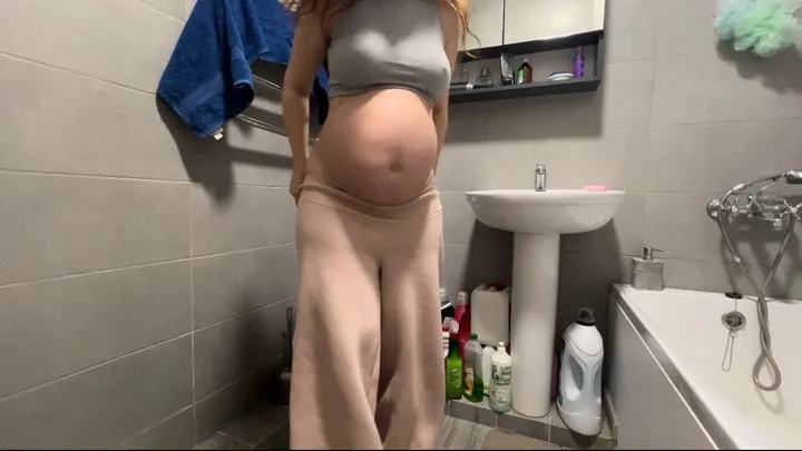 who is spying on a pregnant woman in the toilet?