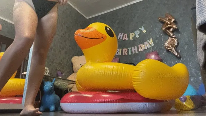 Nacked riding on inflatable duck