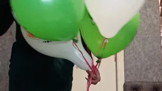 girl in pantyhose and dree play with hellium balloons