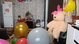 girl poping needle big balloons